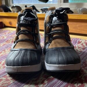 Sorel Kids' Black and Tan Adventure Boots. Worn once, inside the home.